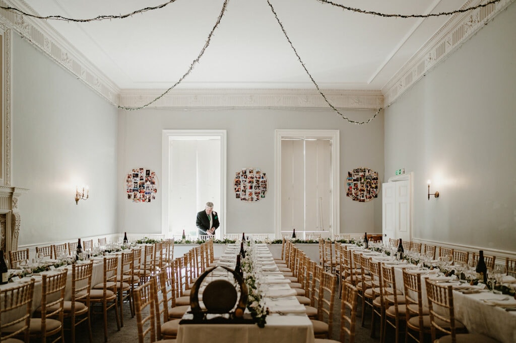 Elegant dining hall prepared for wedding reception.