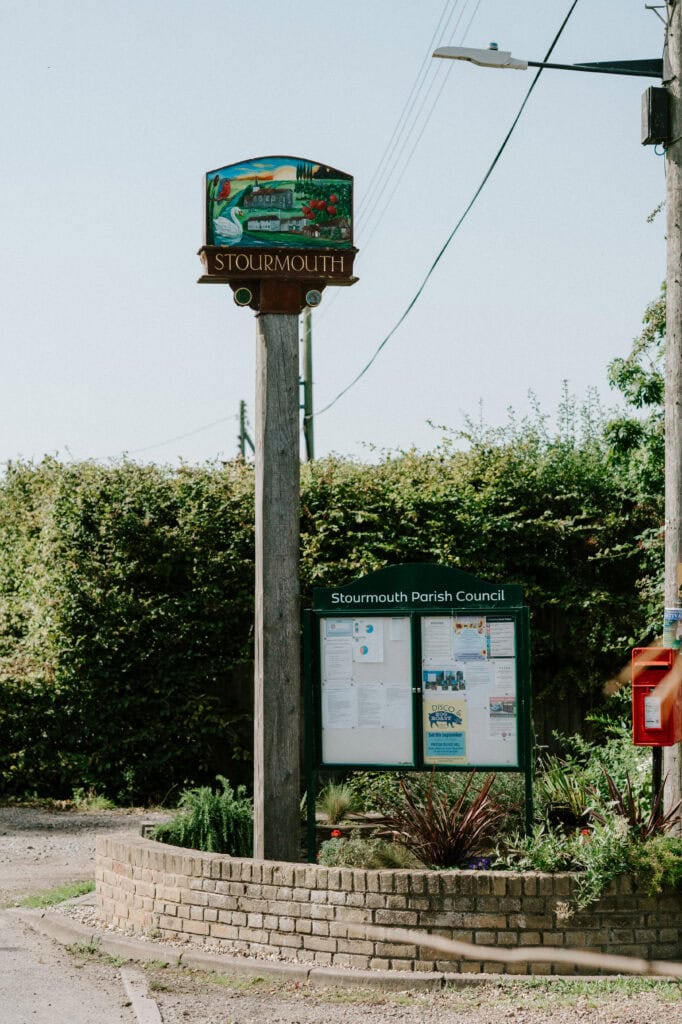 Stourmouth Parish Council information board in a small park.