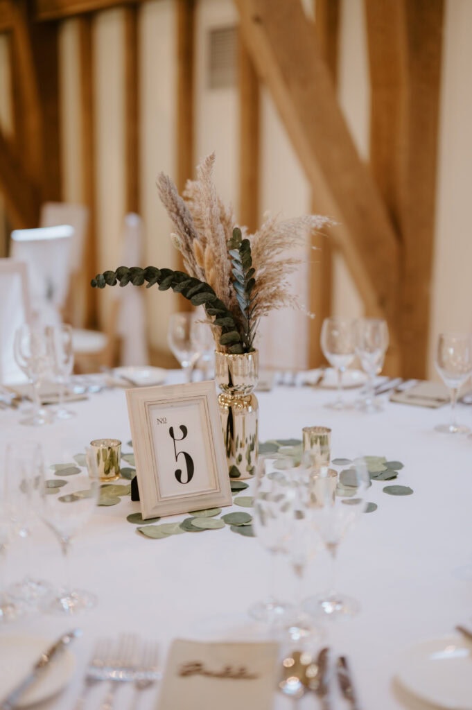 Wedding table setup with number 5 decoration