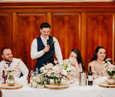 groom cracks a joke during his wedding speech