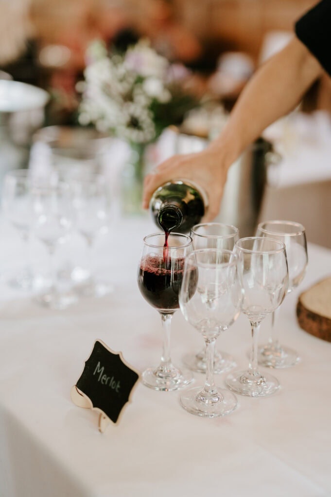 Pouring red wine into a wineglass
