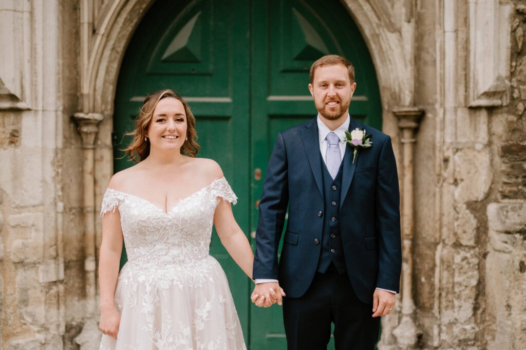 Bride and groom holding hands