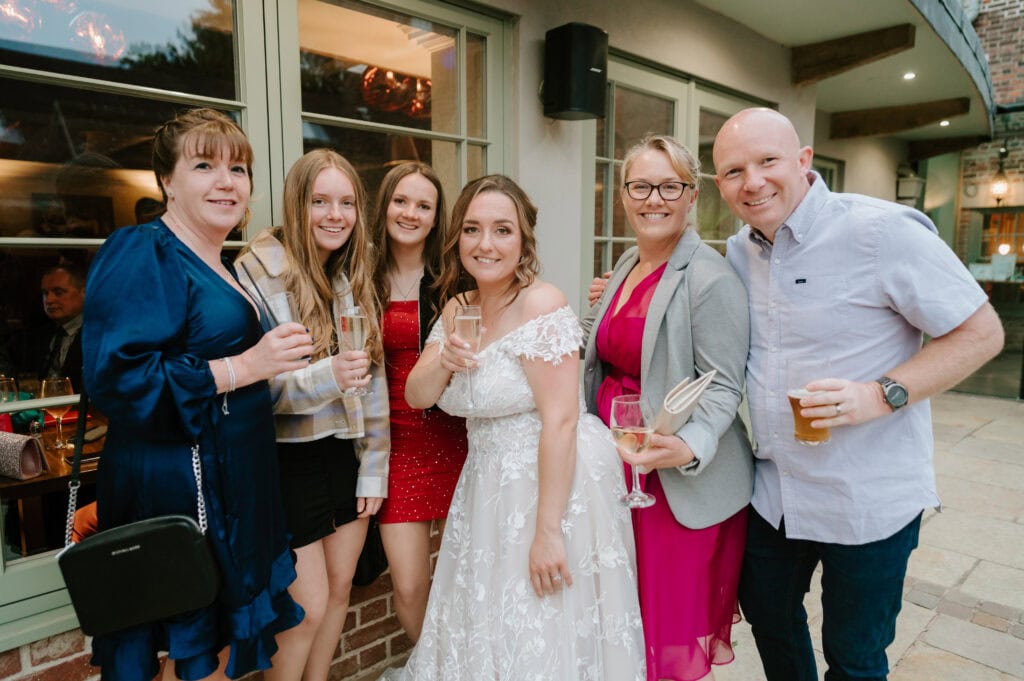 Group celebrating at a wedding reception