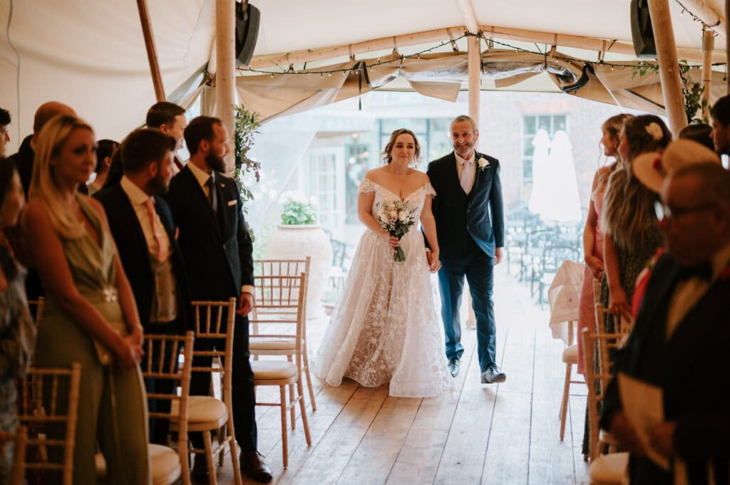Bride and father walking down the aisle