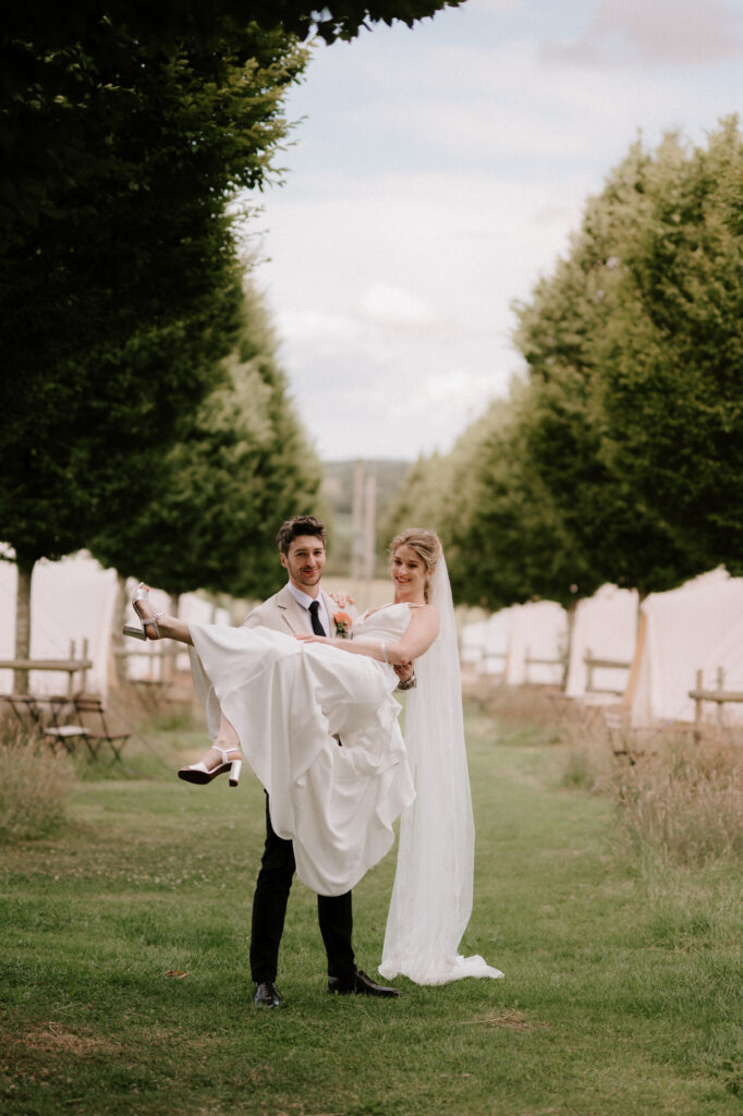 Bride and groom in garden wedding photo.