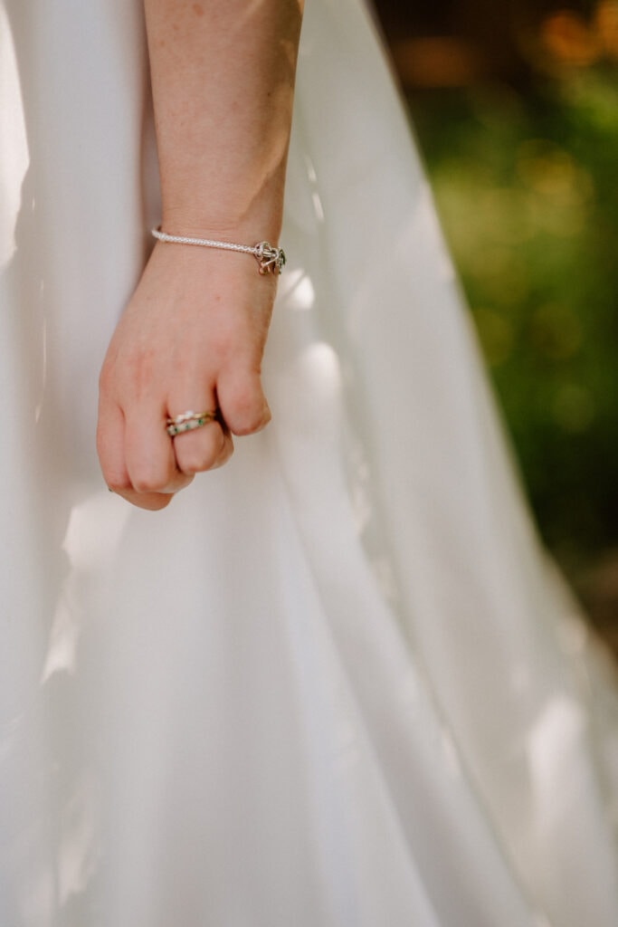 Close-up of a bride's hand with rings.