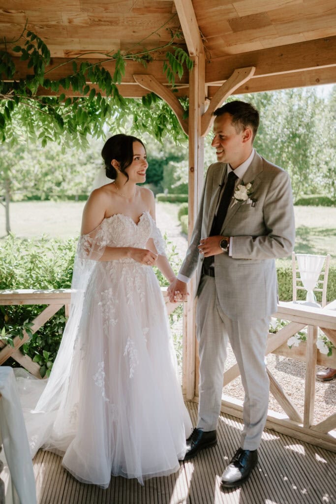 Bride and groom smiling at wedding ceremony