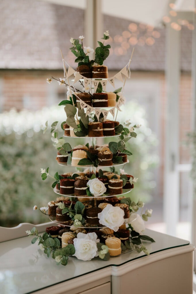 Wedding cake tower with 'Just Married' banner.