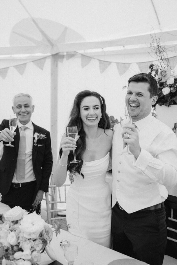 Newlyweds toast during a wedding celebration