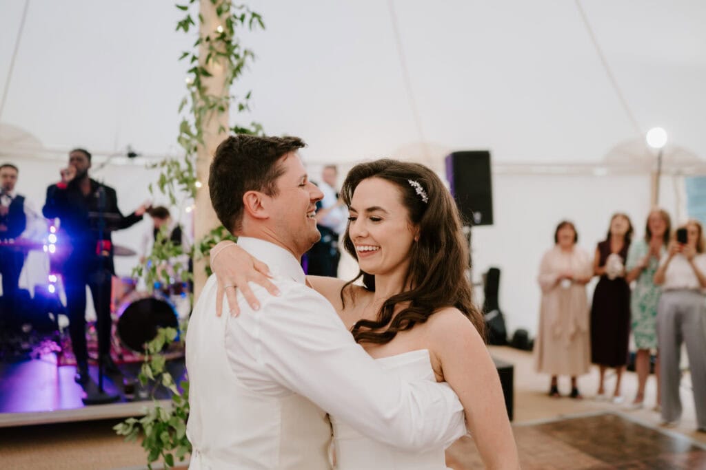 Couple dancing happily at their wedding reception.