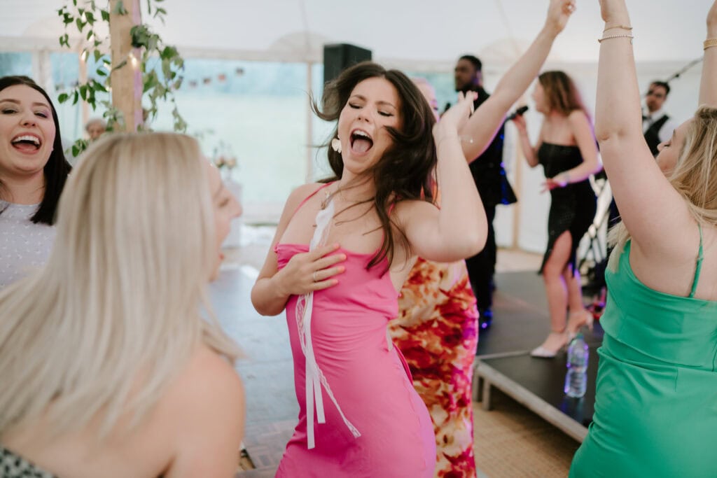 Group dancing joyfully at lively party