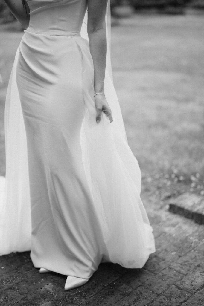 Woman in elegant white dress outdoors