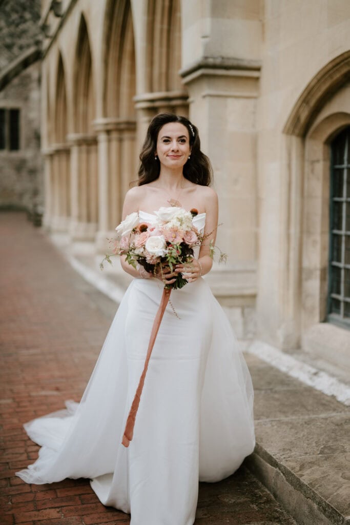 Bride in white dress holding bouquet