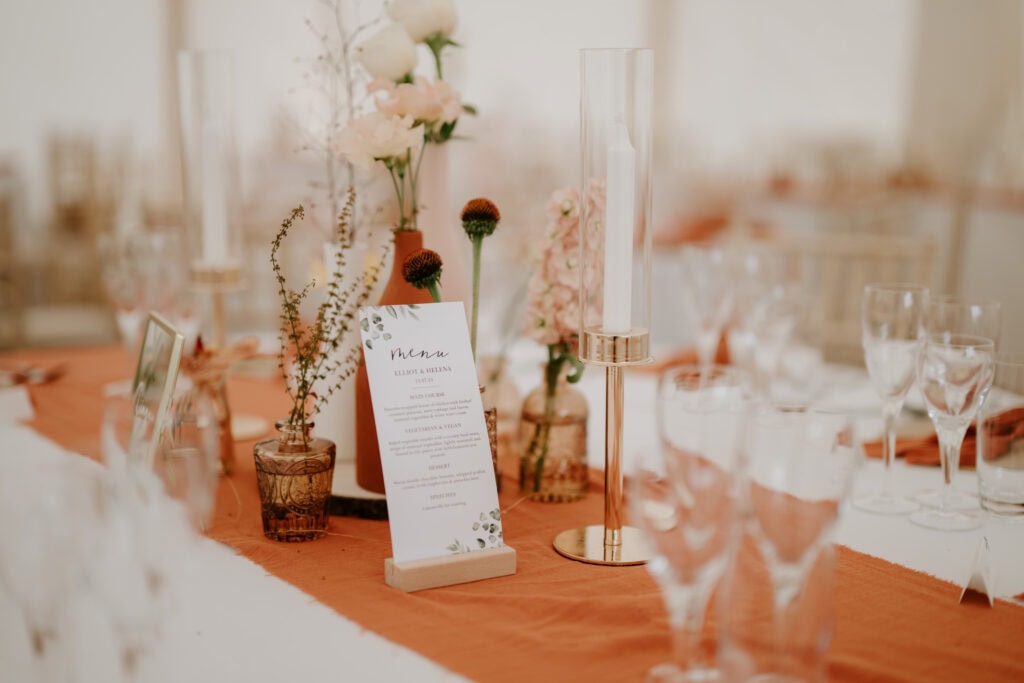 Elegant wedding table setting with floral decor.