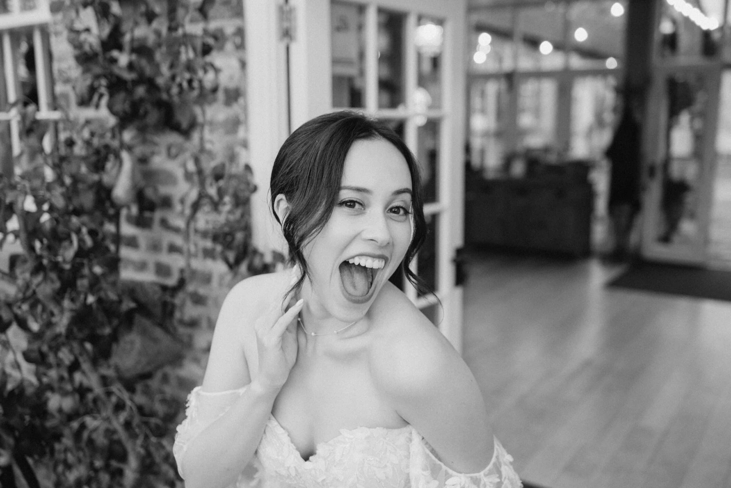 Joyful bride in wedding dress smiling.