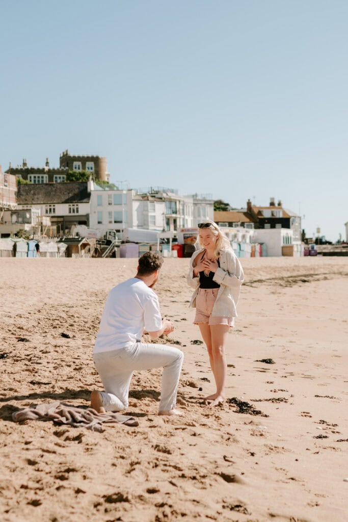 Man proposing on sandy viking bay