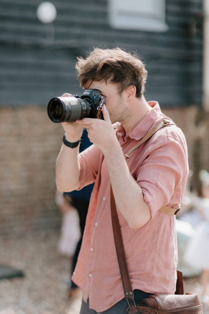 Hythe Wedding Photographer taking a picture outdoors.