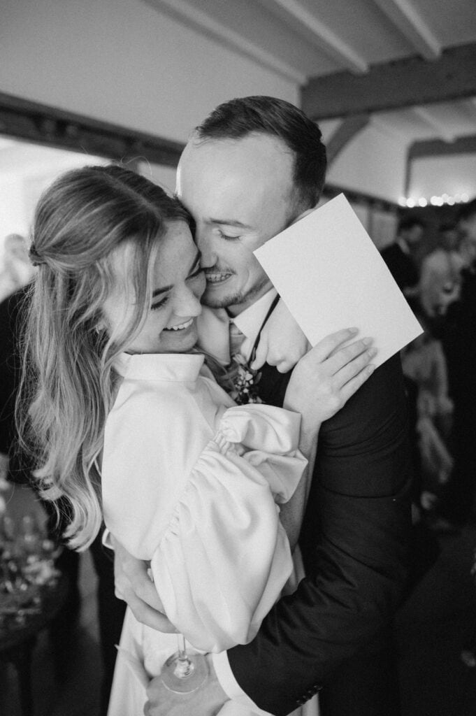 Happy couple embracing at a wedding