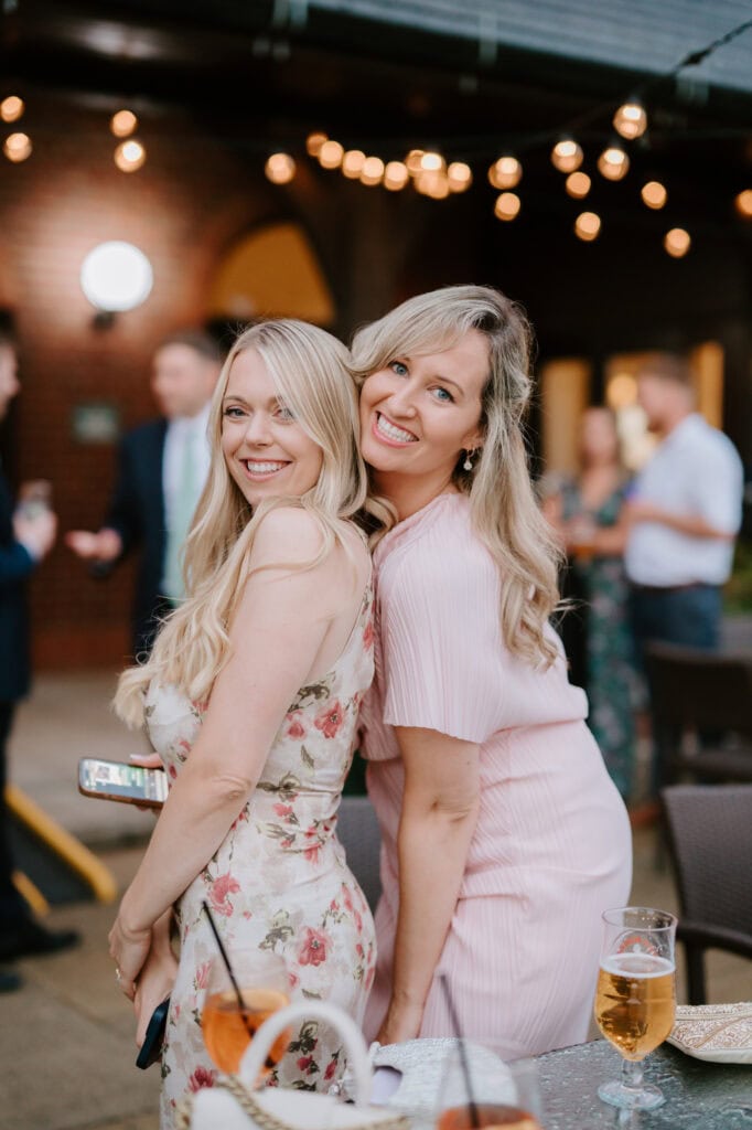 Smiling women at outdoor evening event
