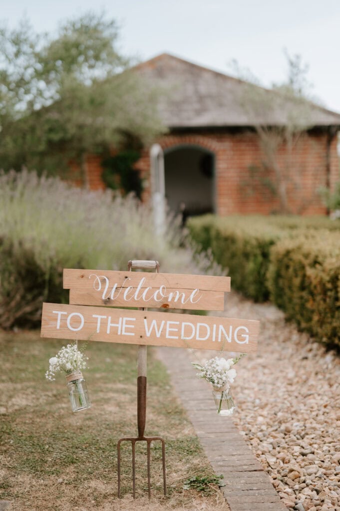 Rustic wedding welcome sign with flowers
