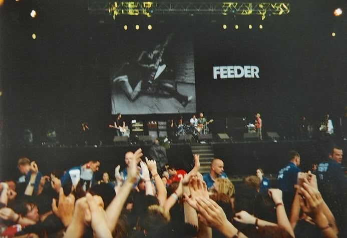 Feeder band performing live at a music festival.