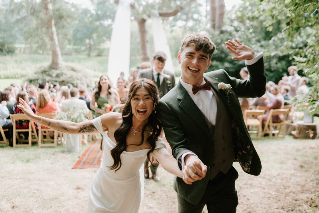 Joyful wedding couple celebrating outdoors