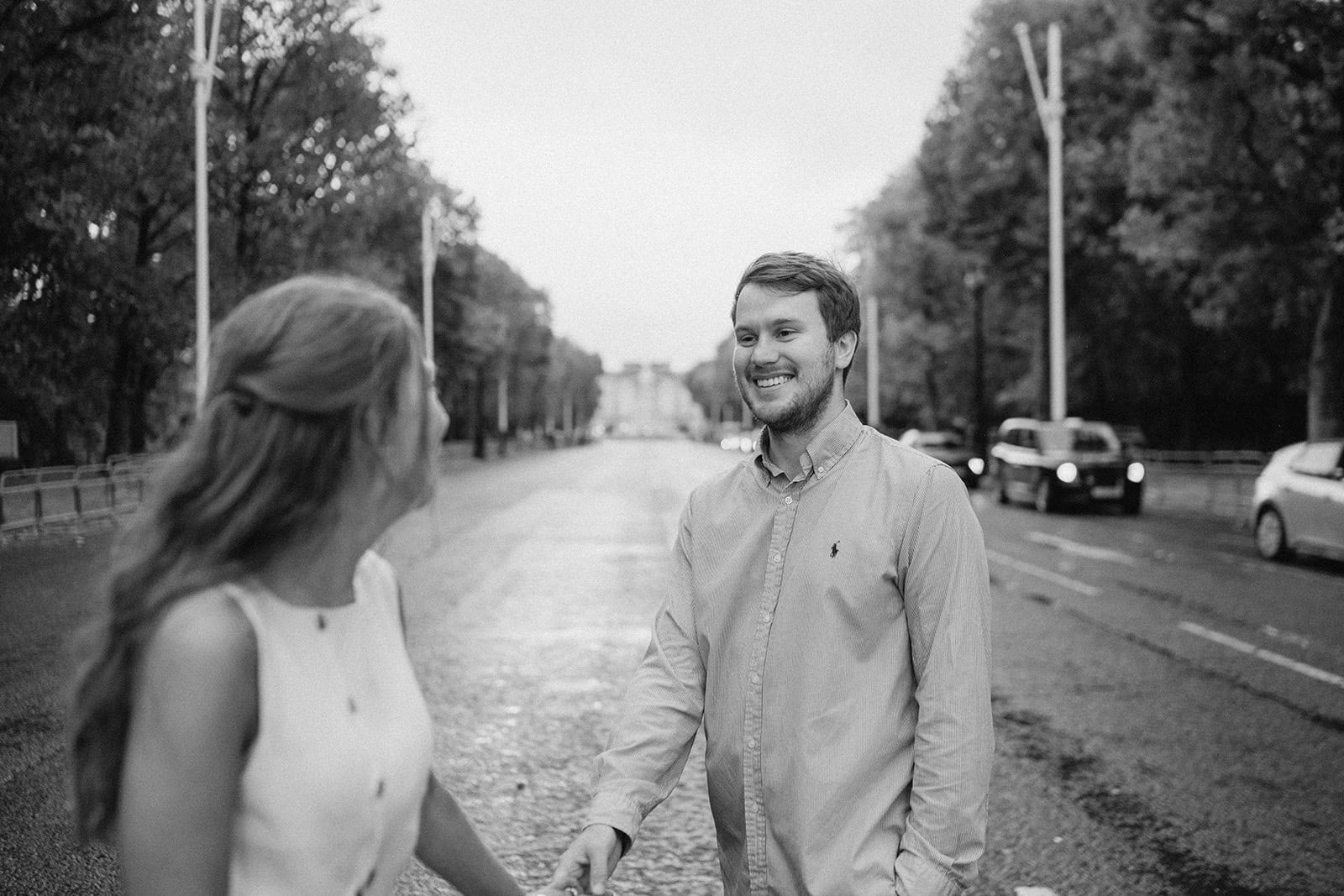 Couple holding hands on a rainy street