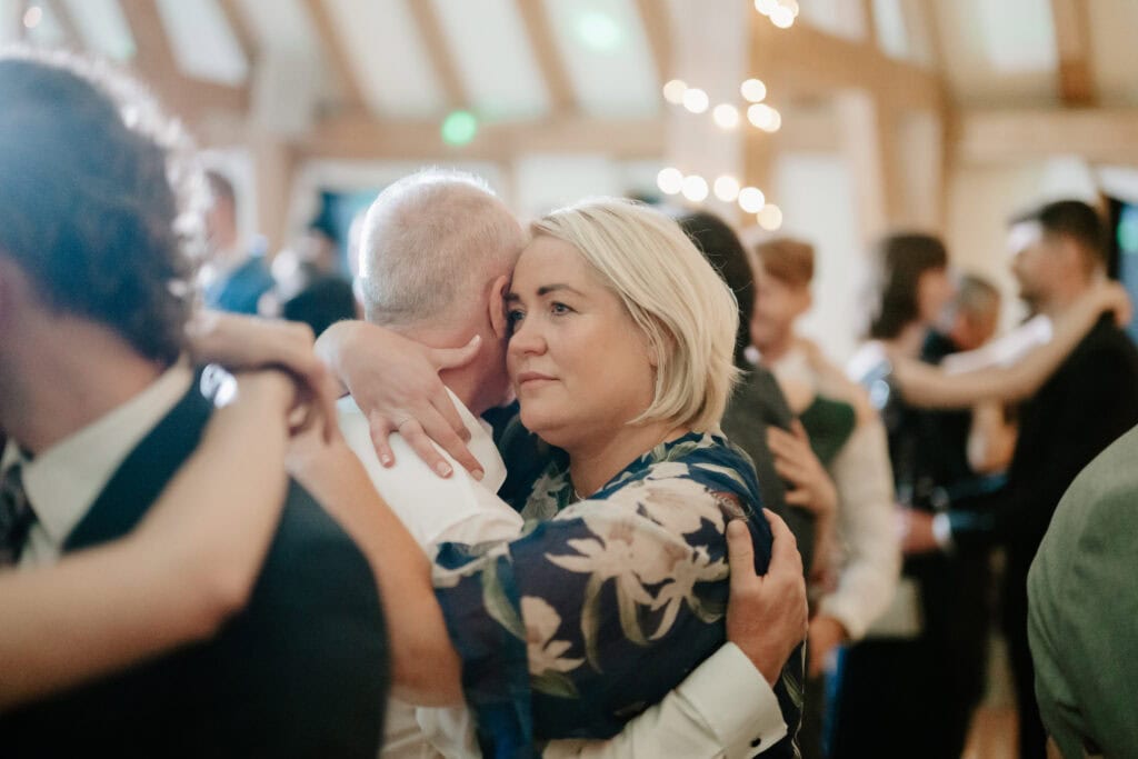 People embracing at a social event