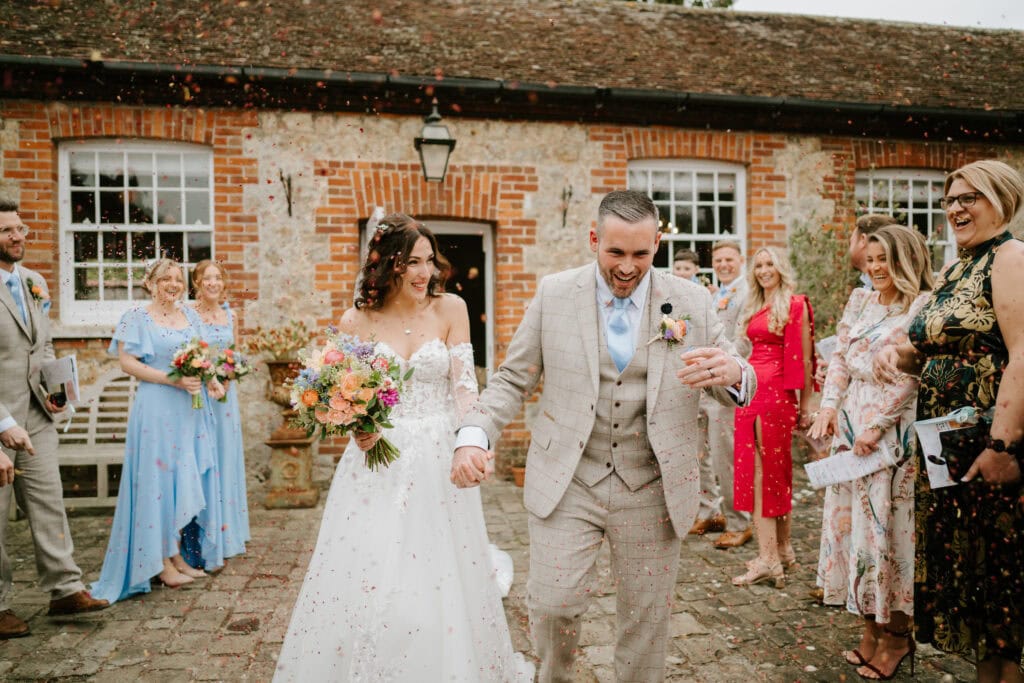 Bride and groom leaving wedding ceremony joyfully