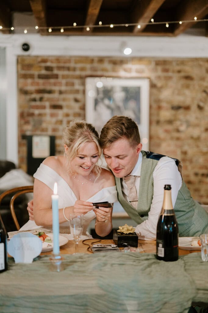 Bride and groom enjoying same day wedding previews together.
