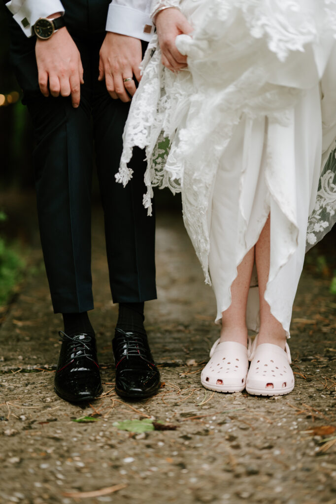 Bride in Crocs, groom in formal shoes.