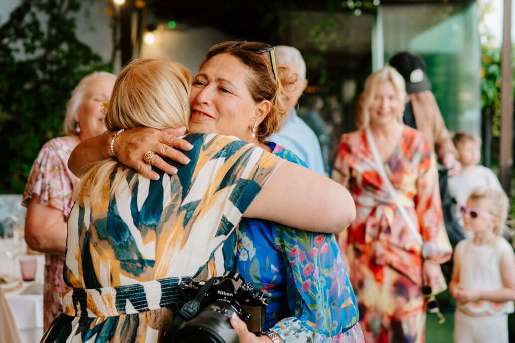 Women hugging at a wedding in granada spain