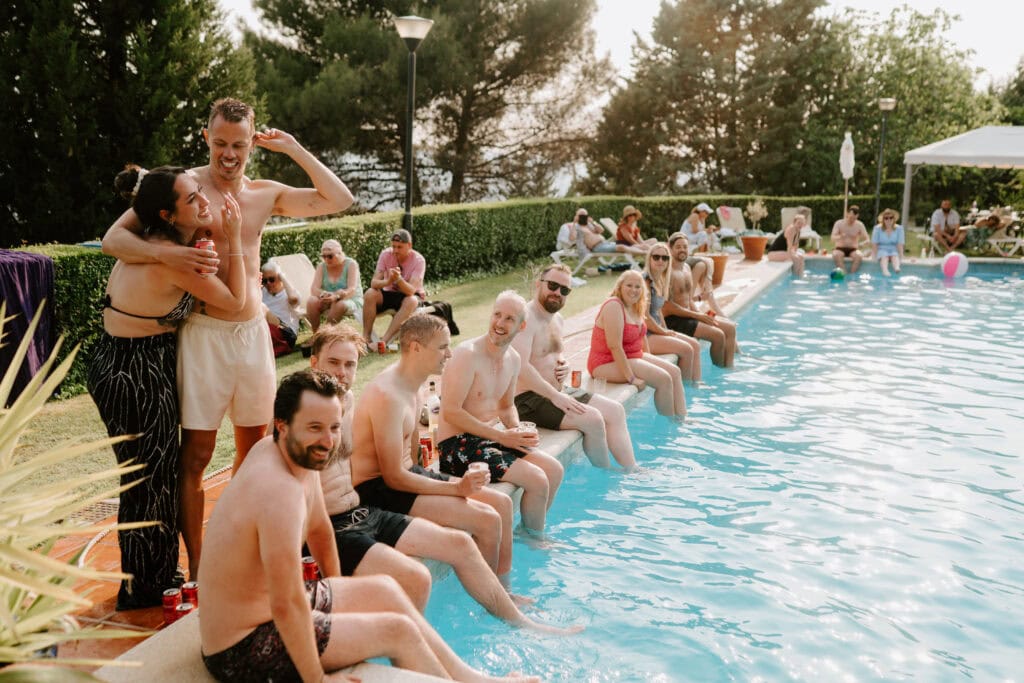 Friends enjoy sunny poolside gathering