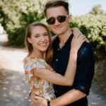 Happy couple embracing in summer outdoors.