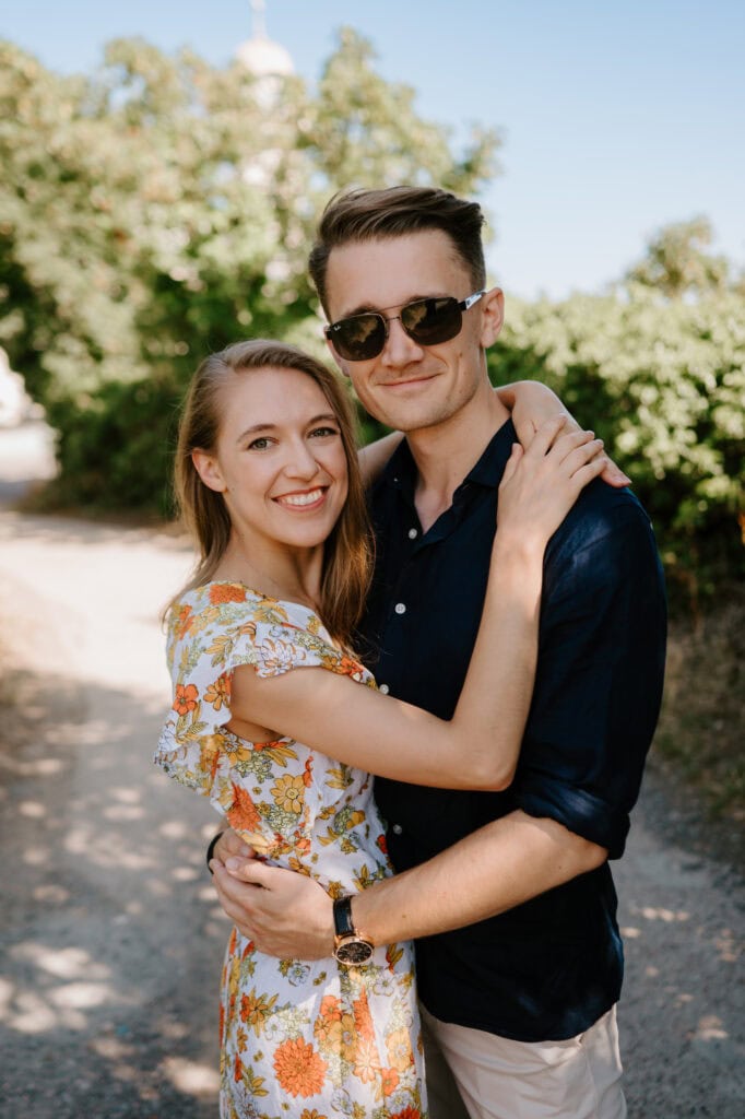 Happy couple embracing in summer outdoors.
