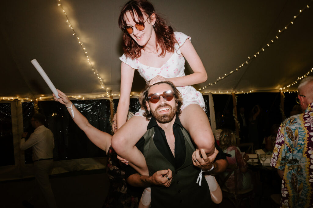 People enjoying party with string lights.