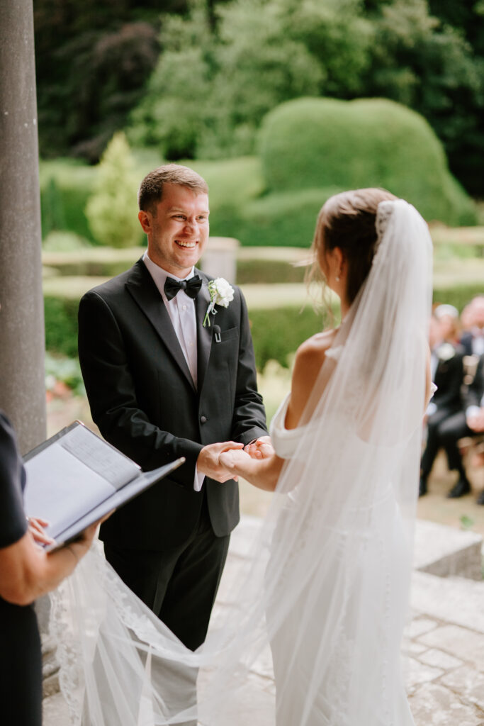 Bride and groom exchanging vows outdoors