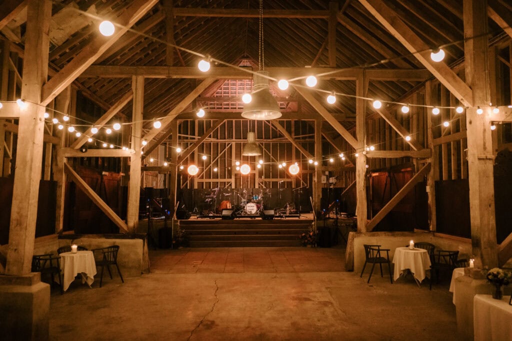 Rustic barn at the updown farmhouse decorated with string lights for a wedding