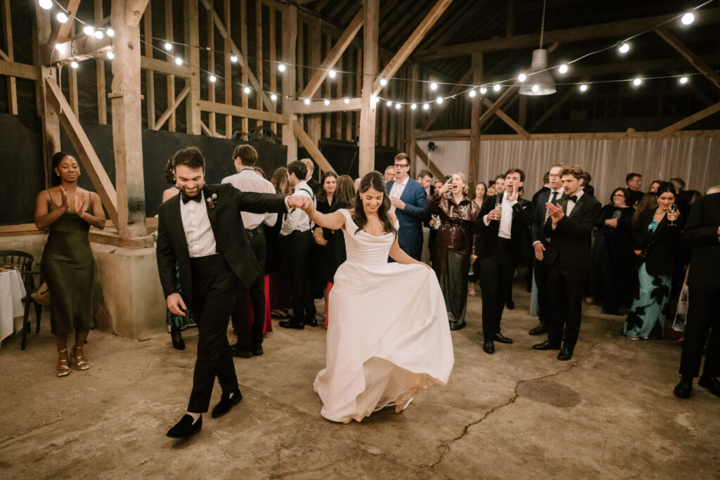 Bride and groom dancing at wedding reception.