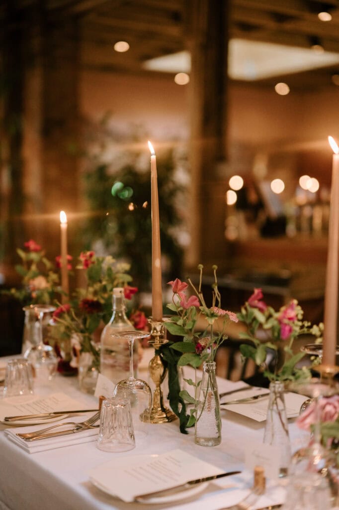Elegant table setting with candles and flowers for updown farmhouse wedding