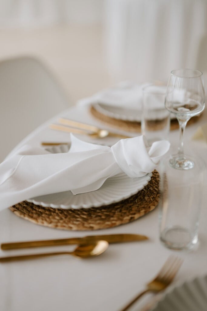 Elegant dining table setting with white napkin